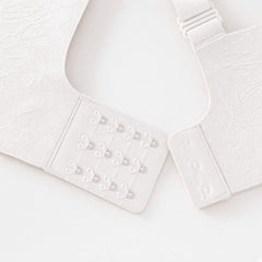 White detail view - back hook-and-eye closure and strap