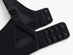 Black detail view - back hook-and-eye closure and adjustable strap