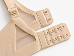 Nude detail view - back hook-and-eye closure and adjustable strap